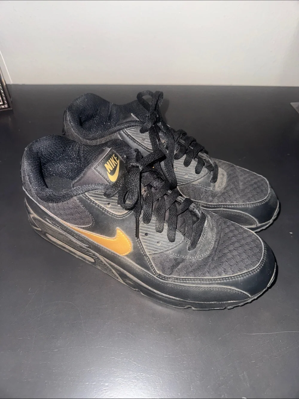 Nike Men's Black Sneakers with Gold Swoosh